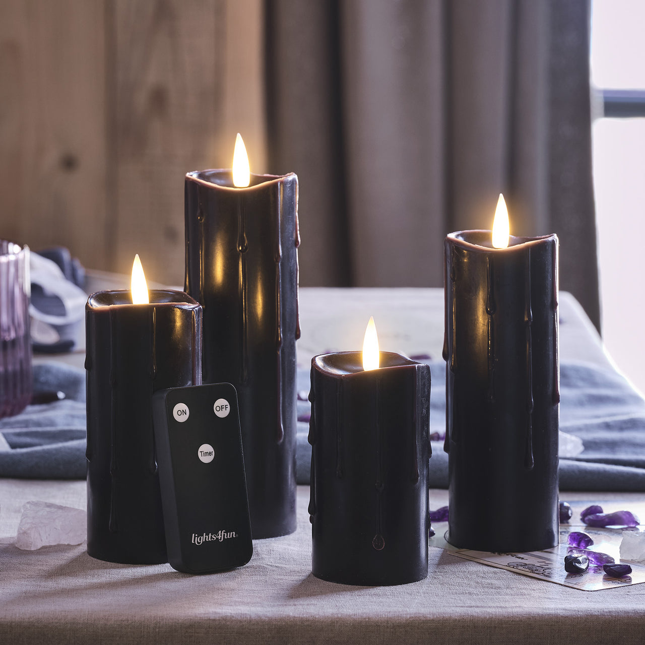 4er Set TruGlow® LED Kerzen Echtwachs schwarz schmal mit Wachstropfen