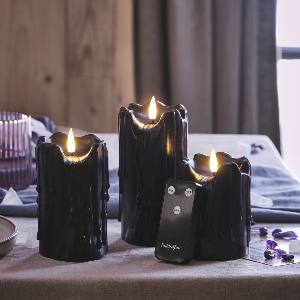 3er Set TruGlow® LED Stumpenkerzen Echtwachs schwarz mit Wachstropfen