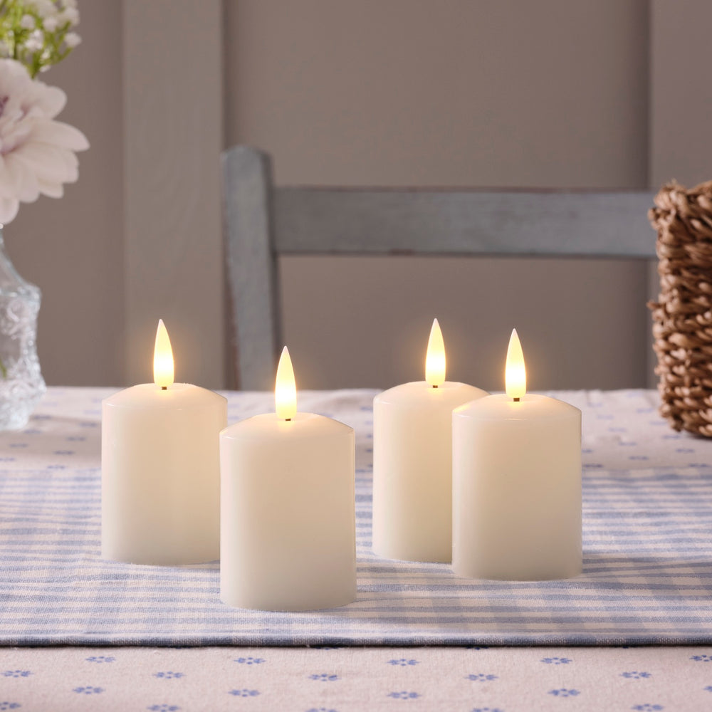 4er Set TruGlow® LED Votivkerzen Echtwachs elfenbeinfarben wiederaufladbar mit Fernbedienung