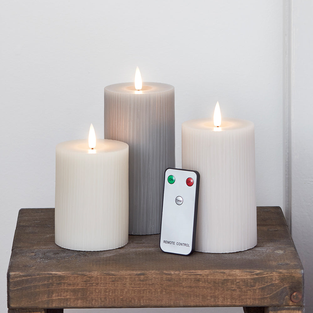 TruGlow® LED Kerzen Trio geriffelt grau mit Fernbedienung