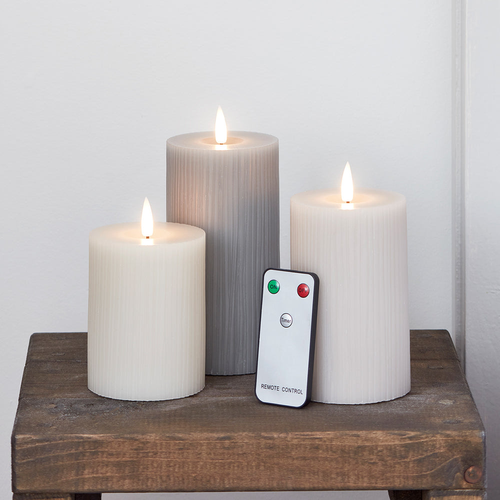 TruGlow® LED Kerzen Echtwachs Trio geriffelt grau mit Fernbedienung