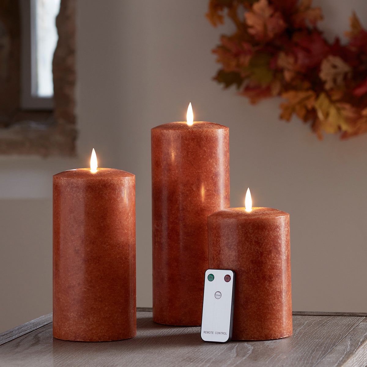 TruGlow® LED Kerzen Trio orange Ø 10cm mit Fernbedienung
